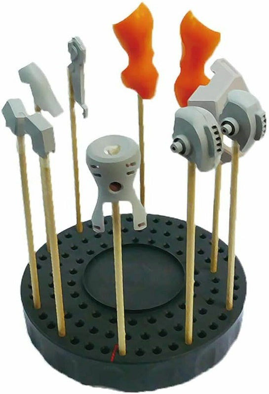 Why hasn't someone ever thought of this before? The TURN In Turn painting base allows you to paint your model-kit parts in order, and to easily keep track of them! The base unit features lots of 3mm diameter holes, able to accept any painting stick, bamboo stick, plastic stick, etc., and you can place them in the order you prefer. To paint, simply choose your first piece, remove its stick from the base, and paint, then return it to the base and move on to the next stick. Once you've gone all the way back to