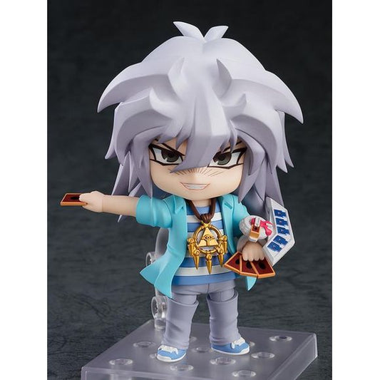 "Let the Shadow Games begin!"

From the smash hit anime series "Yu-Gi-Oh!" comes a Nendoroid of Yami Bakura! He comes with three face plates including a smiling face, an instigating face and a face with his tongue sticking out! Optional parts include a card, a duel disk, the Millennium Ring and the Millennium Eye, allowing you to create your favorite scenes from the series in Nendoroid form! Be sure to display him with Nendoroid Yami Yugi and Nendoroid Dark Magician Girl (both sold separately) and enjoy a S