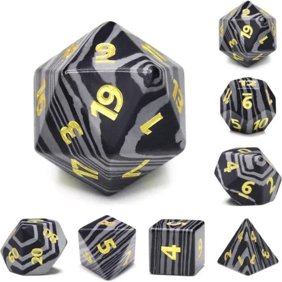 The perfect companion for your gaming needs! Made of resin and quartz sand to create artificial stone. These premium dice are exactly what you've been searching for that upcoming game night with the group. 

This set includes on of each: d20, d12, d10, d10 (percentile), d8, d6, and a d4 (7 dice in total). All inside the Galactic Toys Dice Tin.