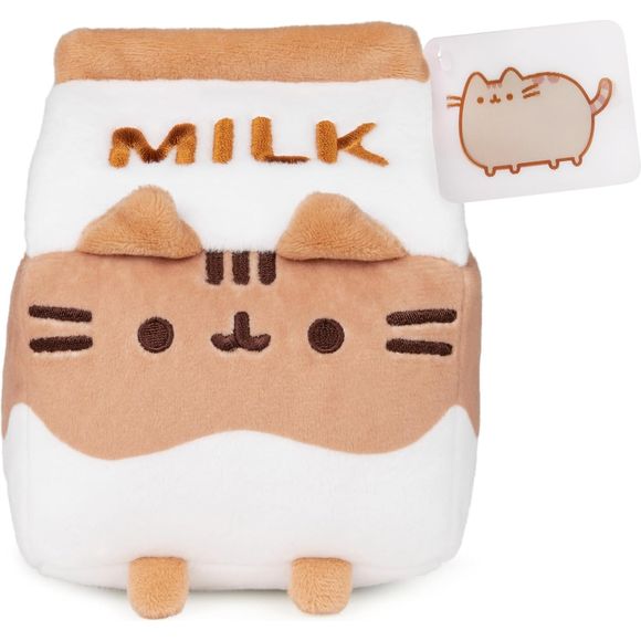 This cute Pusheen sip stands six inches tall and has soft brown and white plush accented by embroidered details, including a chocolate chunk on each side. The carton features Pusheen’s signature smile, whiskers, pointed ears, and her brown-and-white striped tail.