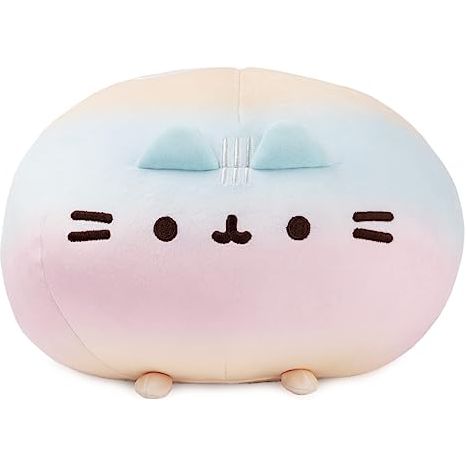 Pusheen is here as a round, delightfully squishy Squisheen! Made from a super-soft elastic fabric, this round pastel rainbow ombre Pusheen plush stands 11” tall and features Pusheen’s signature smile, paws and tail, all in a huggable round shape. Available in multiple colors and surface-washable for easy cleaning. Appropriate for ages 8 and up. Each Pusheen Squisheen plush ships in a protective poly bag.